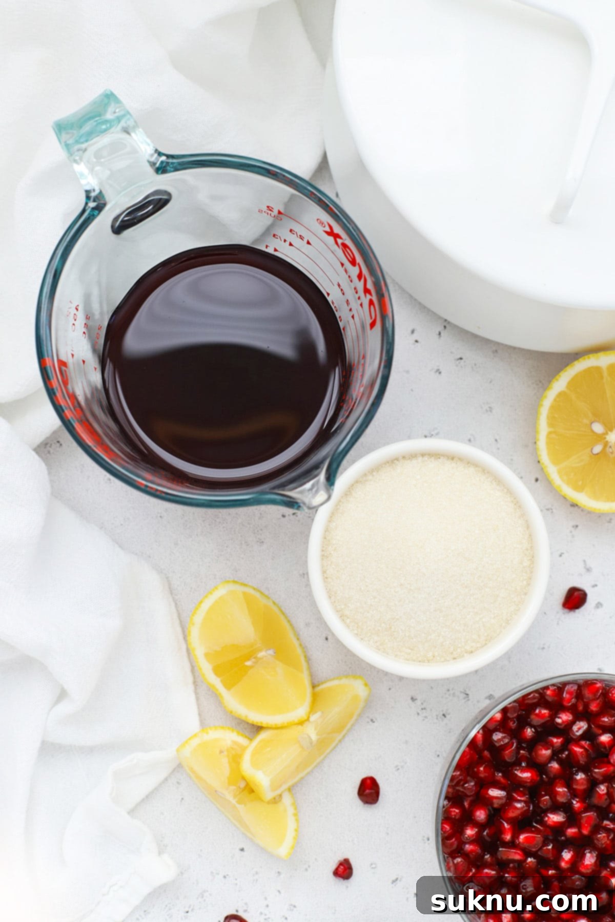 Easy Homemade Grenadine Three Ingredients 5 Overhead view of ingredients for homemade grenadine syrup for cocktails or mocktails