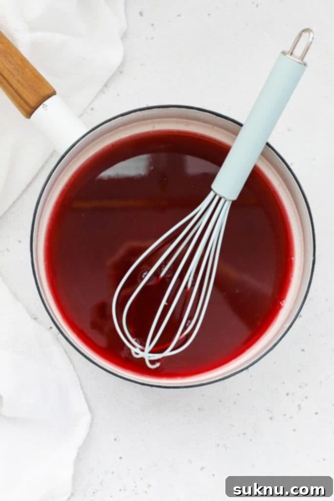 Easy Homemade Grenadine Three Ingredients 7 Overhead view of a saucepan full of homemade grenadine syrup
