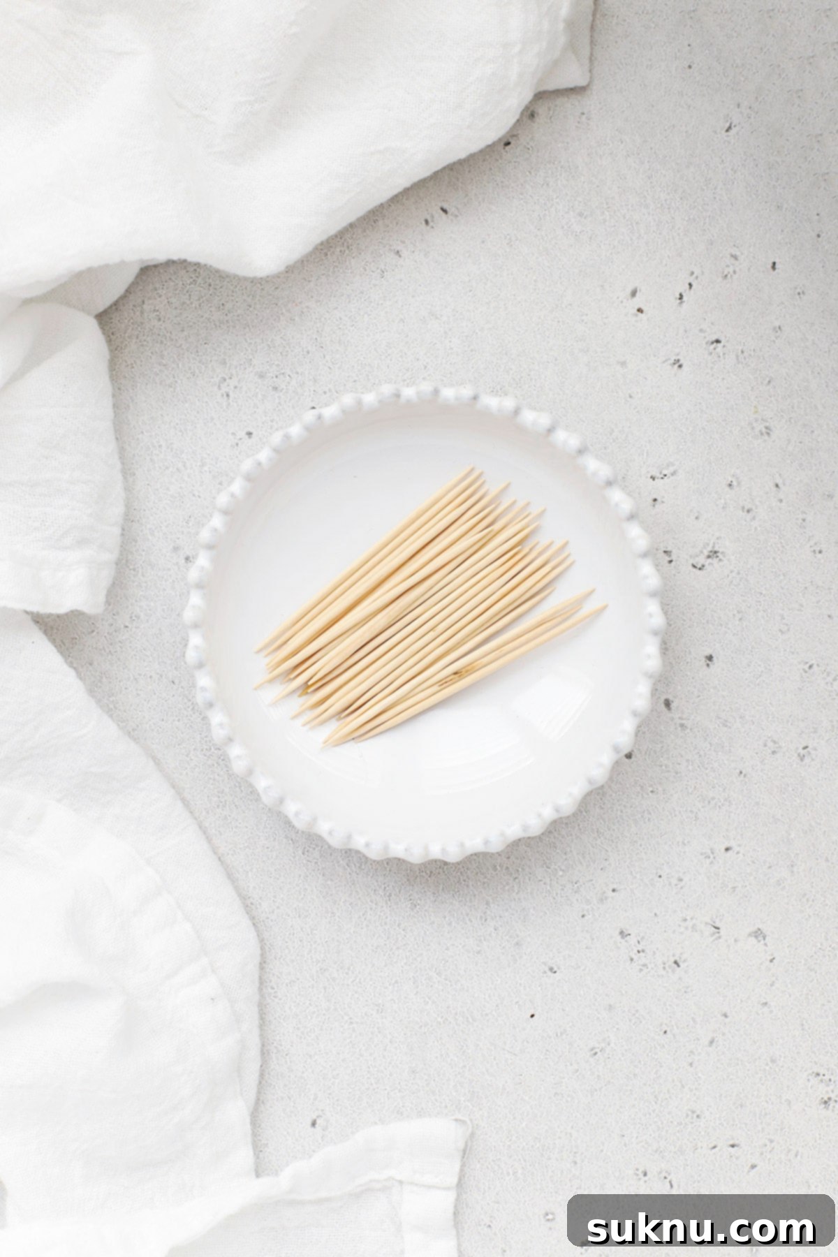 Toothpicks and a small knife ready to test the doneness of banana bread.