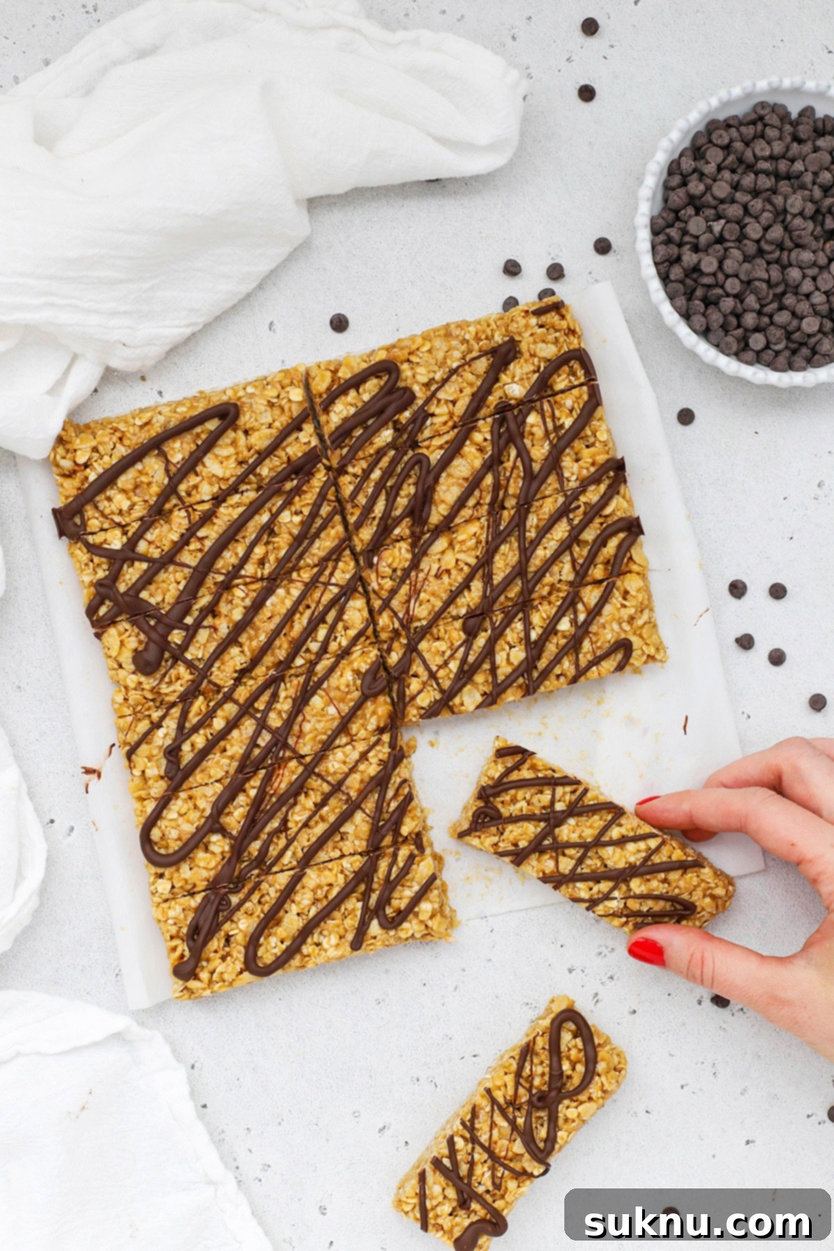 Reaching for a soft no-bake peanut butter granola bar, a perfect healthy snack