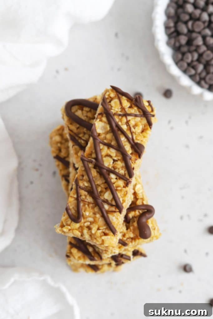 Overhead view of healthy peanut butter granola bars drizzled with chocolate