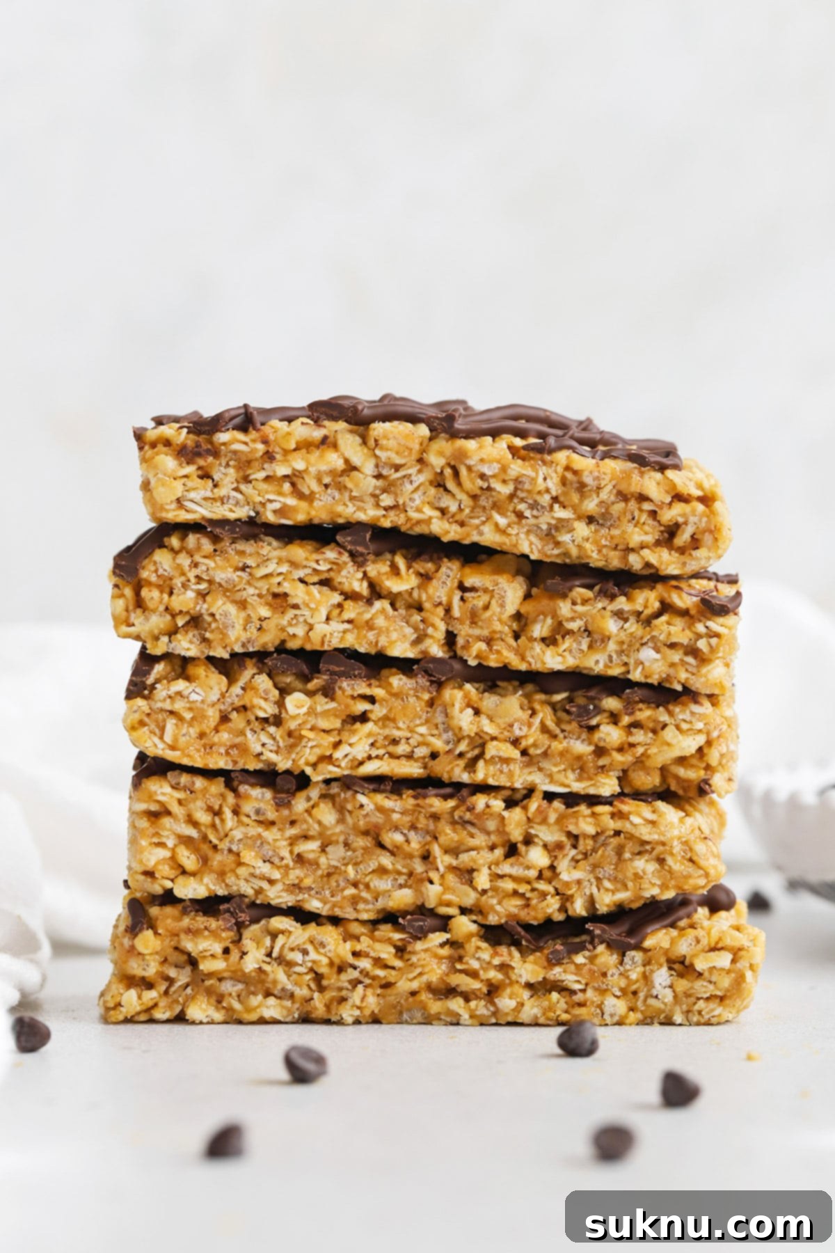 Front view of healthy peanut butter granola bars drizzled with chocolate, a delicious homemade snack