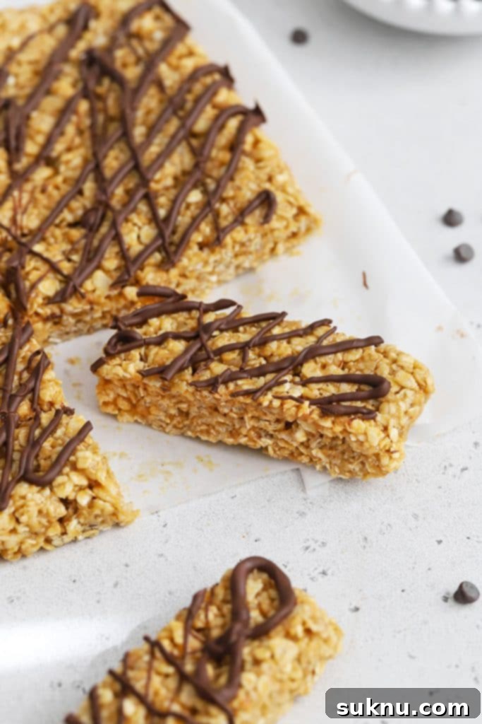 Front view of healthy peanut butter granola bars drizzled with chocolate