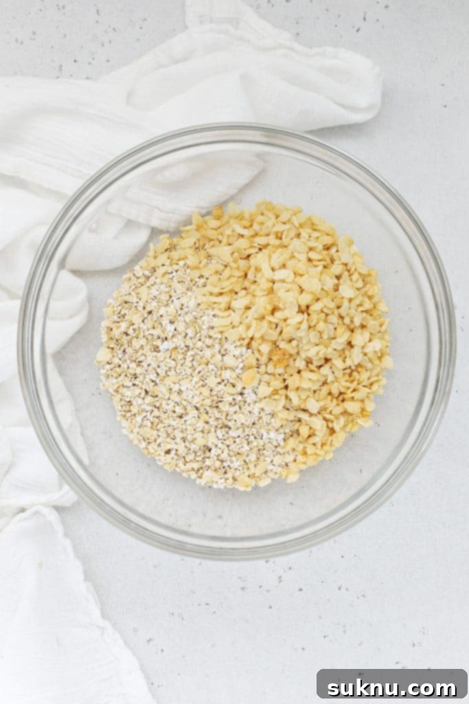 Mixing gluten-free oats and brown rice cereal to make healthy peanut butter granola bars
