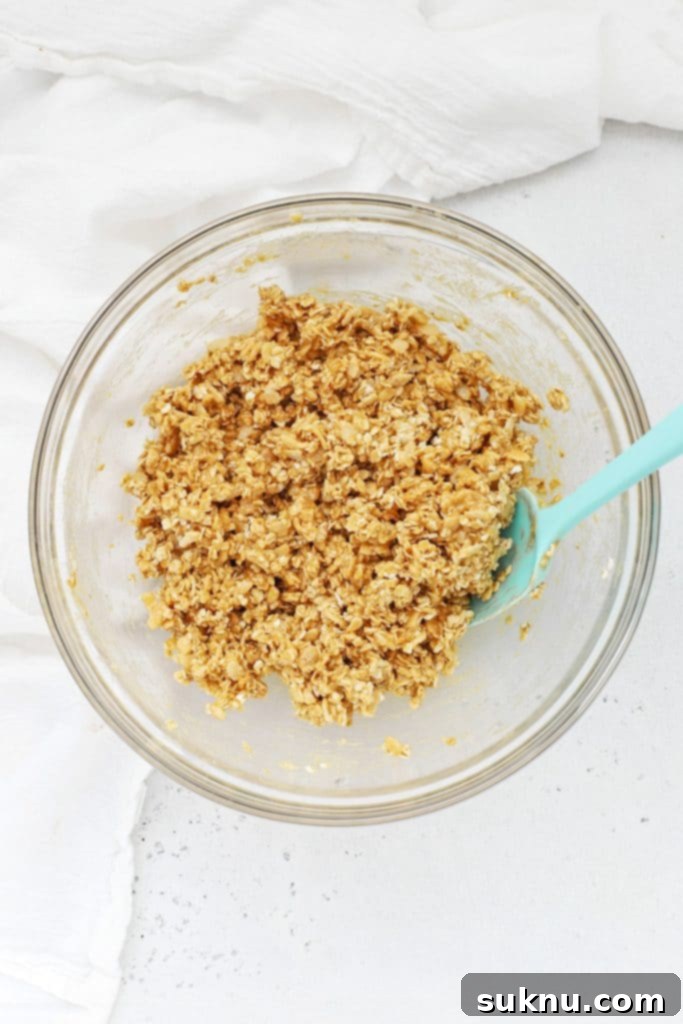 Combining the ingredients for peanut butter granola bars