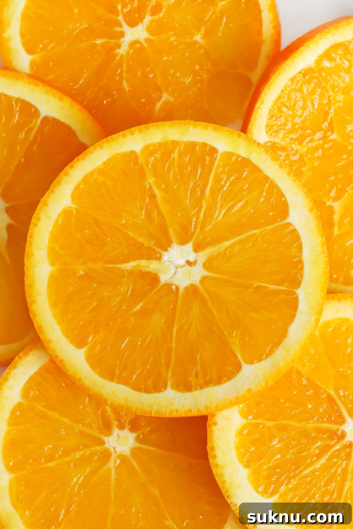 Fresh orange slices, perfect for garnishing virgin sunrise mocktails