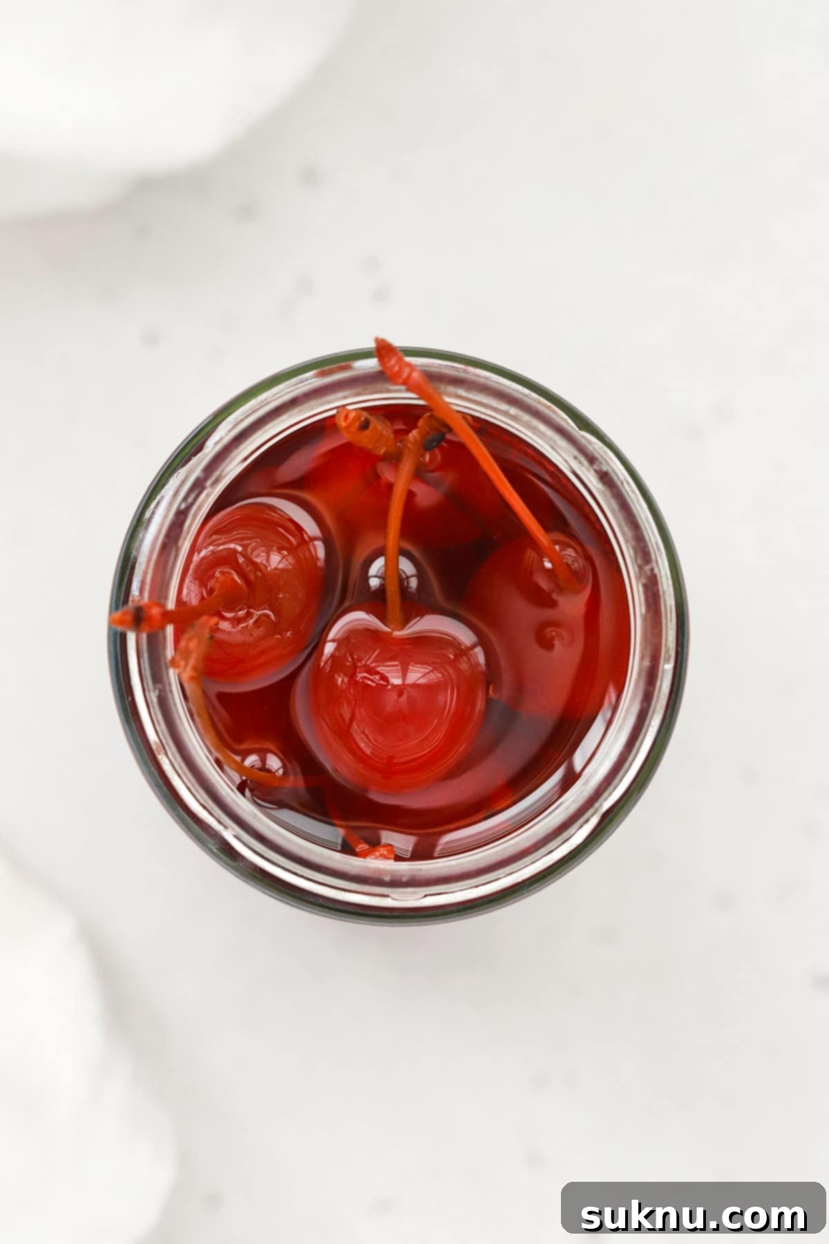 Sweet maraschino cherries, a classic garnish for orange juice grenadine mocktails