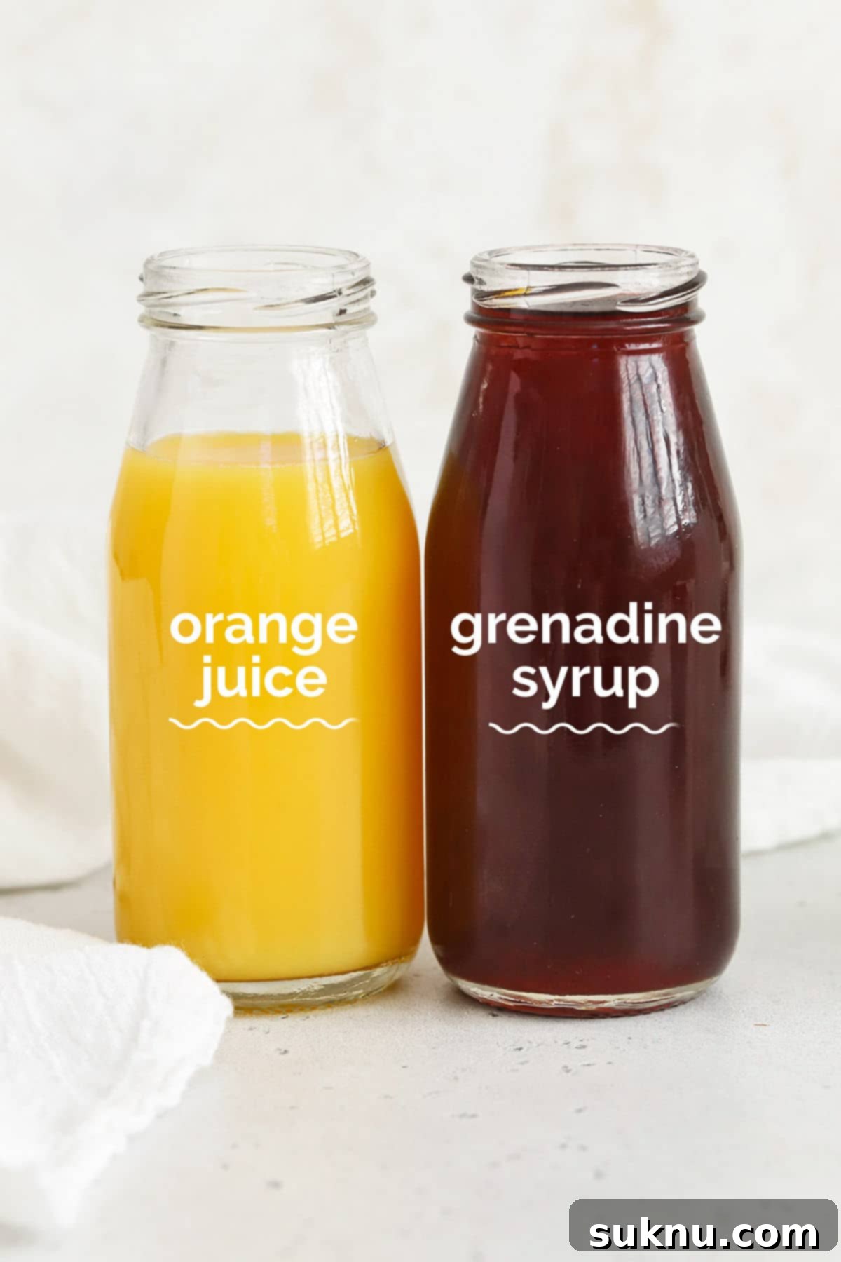 Orange juice and grenadine ready to be combined for sweet sunrise mocktails