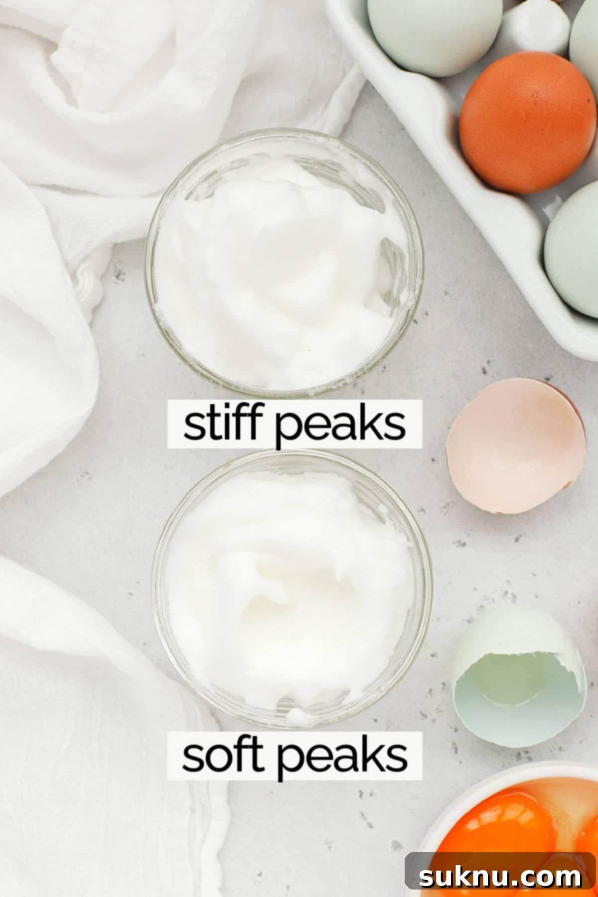 Mastering Whipped Egg Whites: Stiff and Soft Peak Techniques 10 Overhead view of a bowl of egg whites whipped to soft peaks and a bowl of egg whites whipped to stiff peaks, for comparison