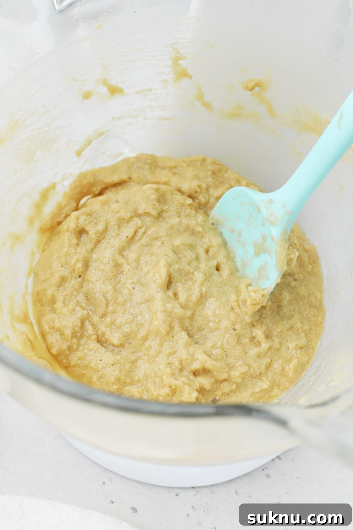 Creamed sugar, butter and eggs for gluten-free thick chocolate peanut butter chip cookies