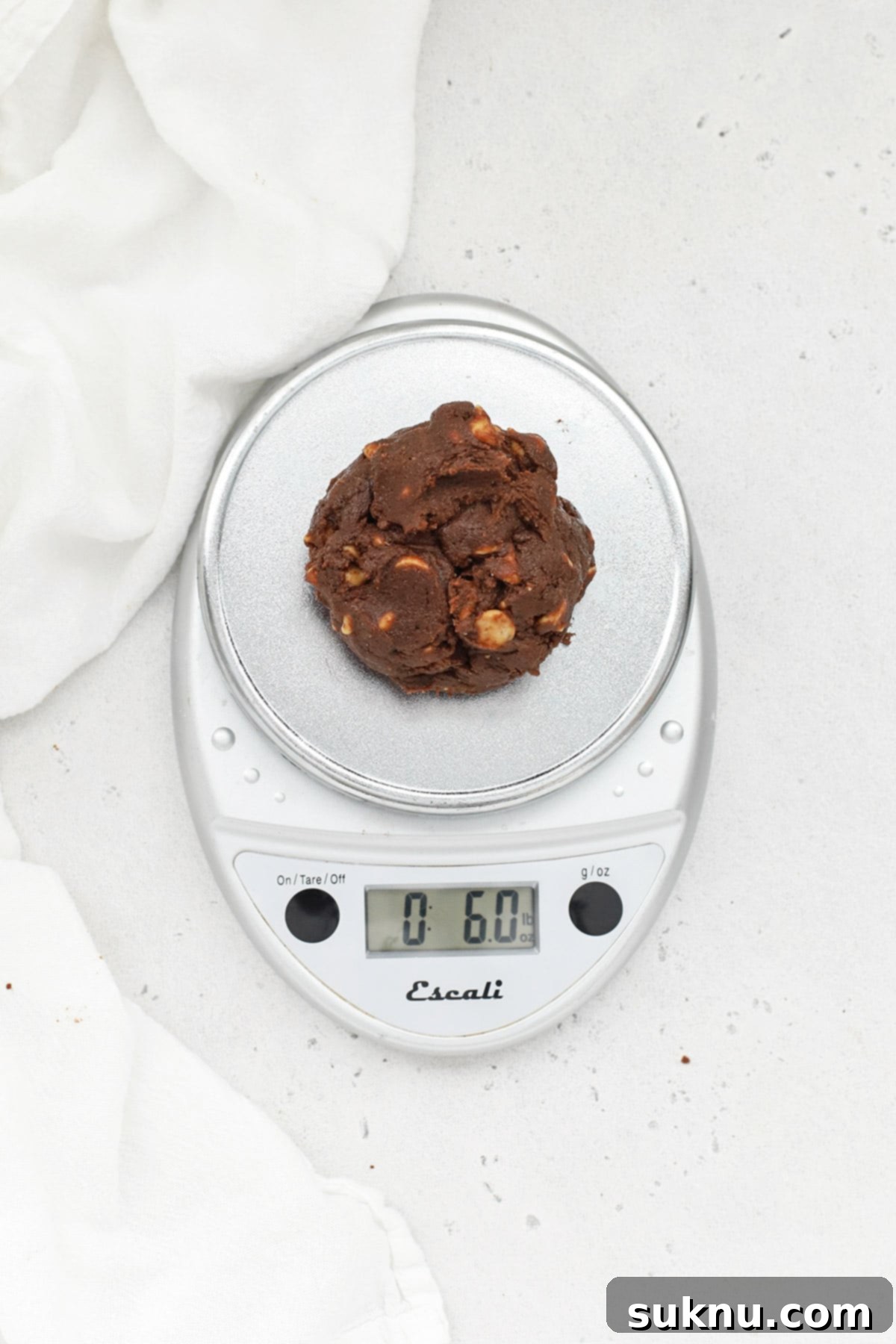 Weighing chocolate peanut butter chip cookie dough