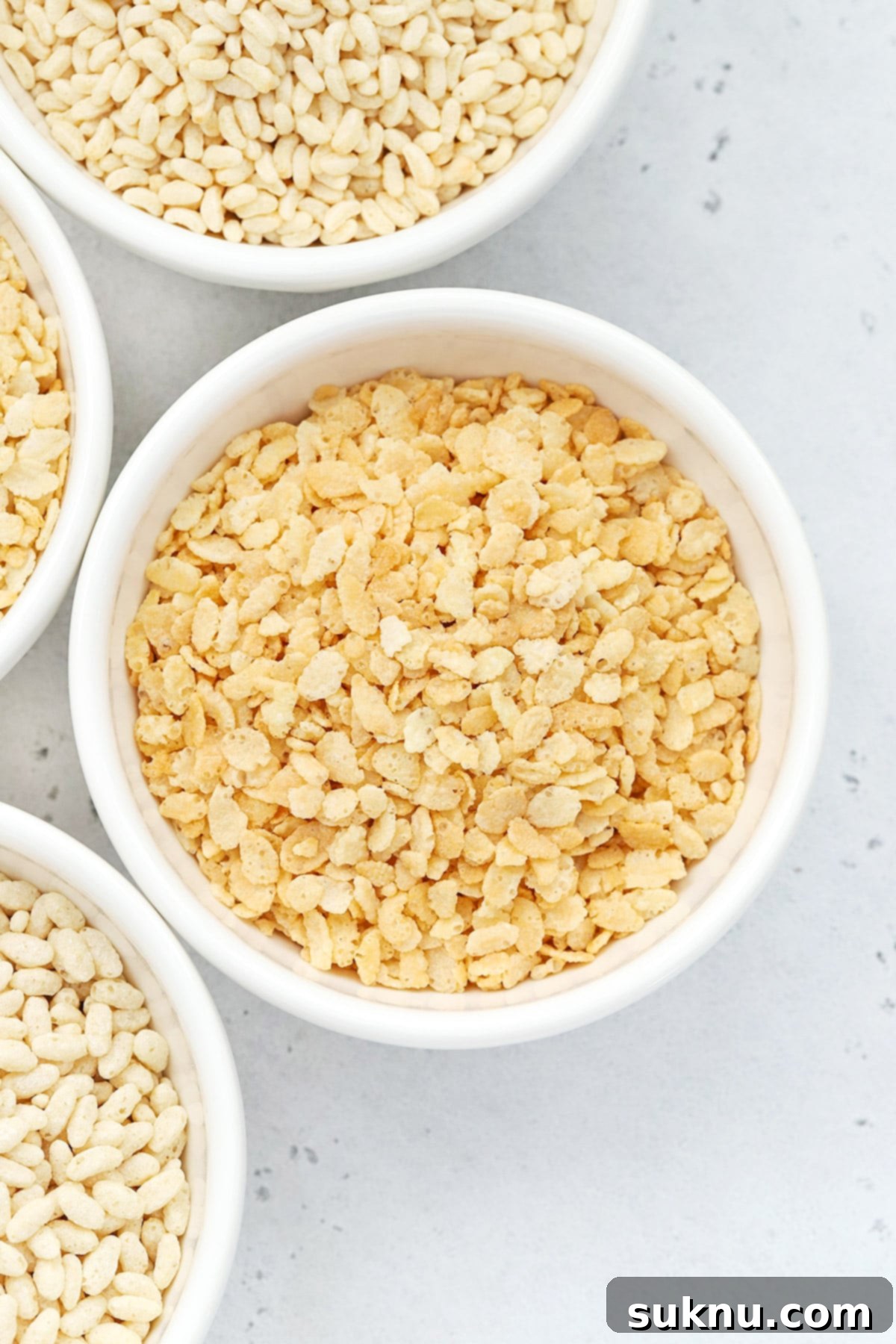 Overhead view of four bowls of gluten-free rice krispies cereals