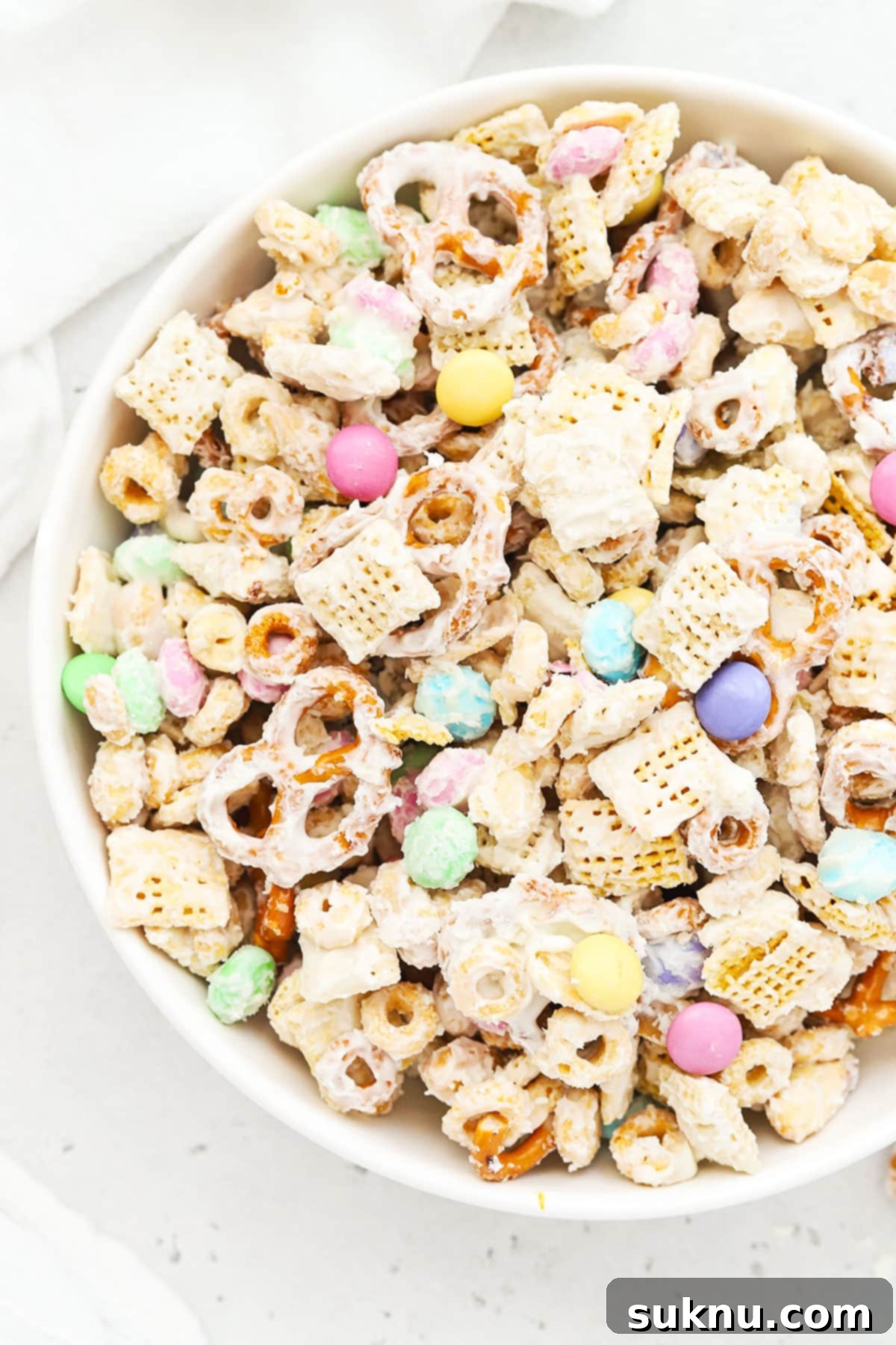 Gluten-Free Easter Bunny Bait Chex Mix 2 Large bowl of bunny bait easter chex mix with pastel m&ms, gluten-free pretzels, and Chex cereal