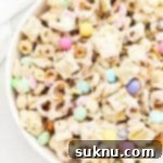 Gluten-Free Easter Bunny Bait Chex Mix 16 Large bowl of bunny bait easter chex mix with pastel m&ms, gluten-free pretzels, and Chex cereal
