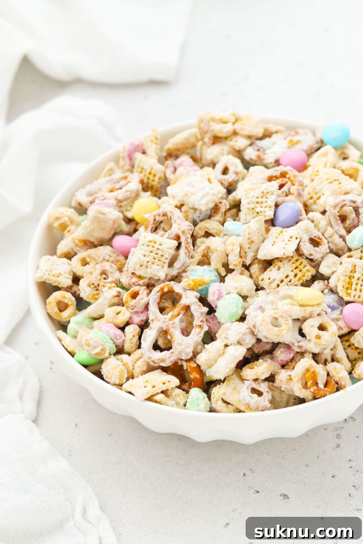 Gluten-Free Easter Bunny Bait Chex Mix 3 easter chex mix in a white dessert bowl