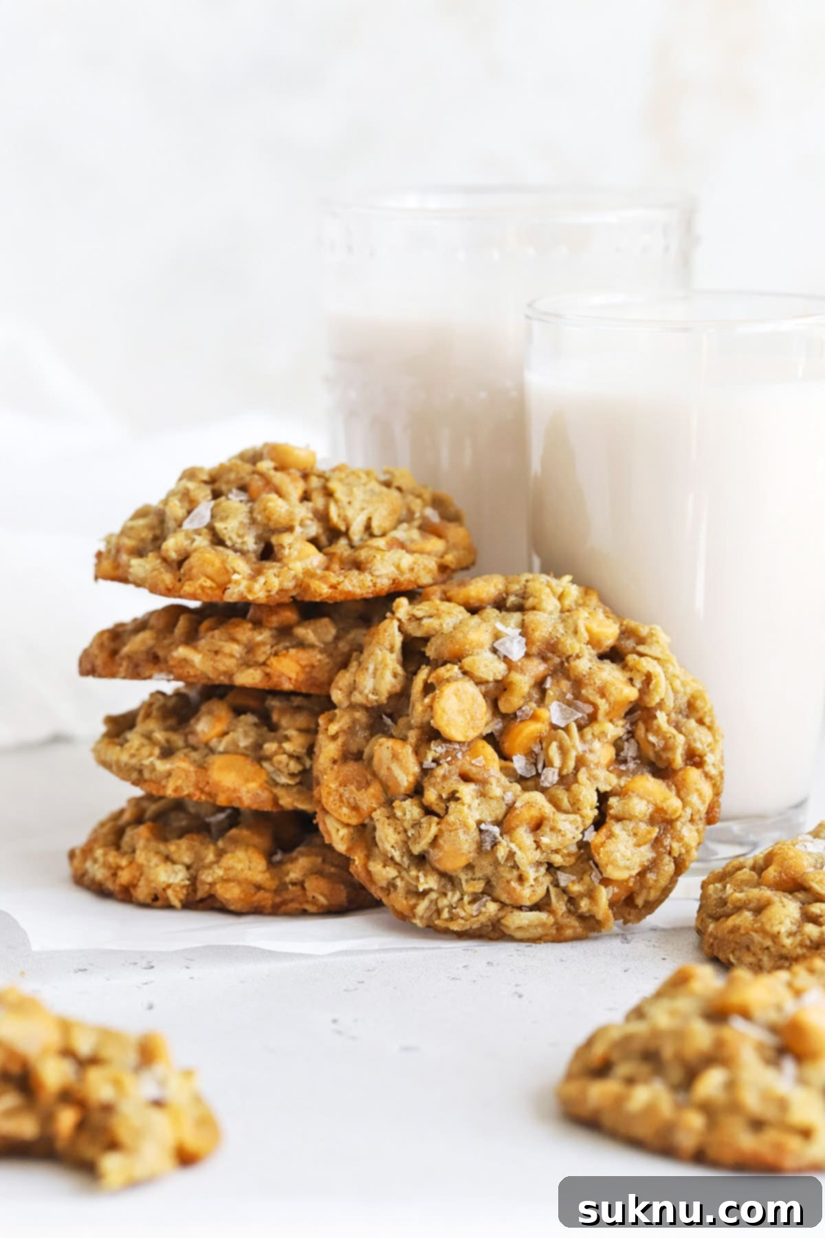A stack of perfectly baked gluten-free oatmeal scotchies, showcasing their soft, chewy texture and butterscotch chips.