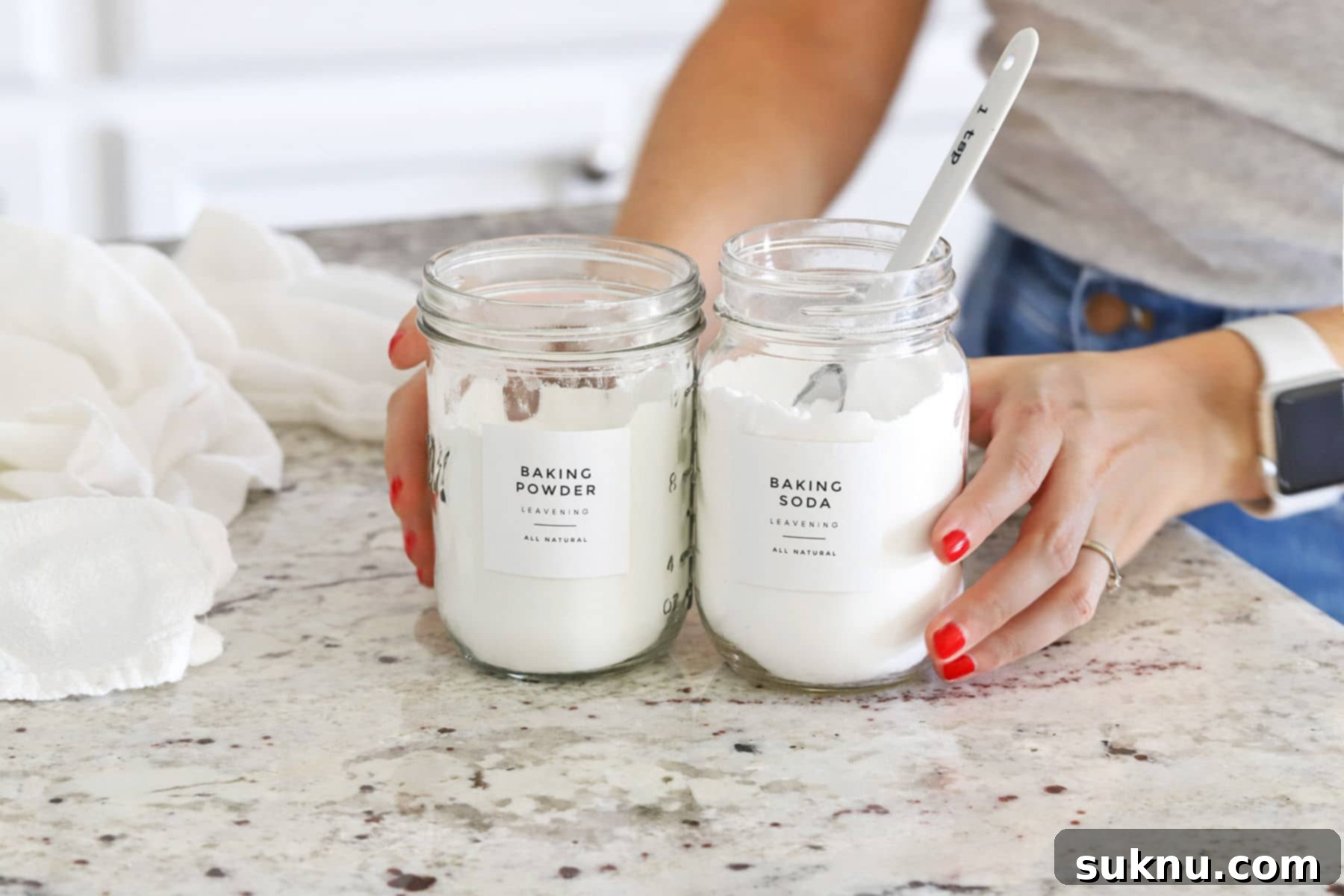 Are Your Baking Powder and Soda Still Potent 3 Jars of baking soda and baking powder ready for testing freshness, a vital step for successful baking.