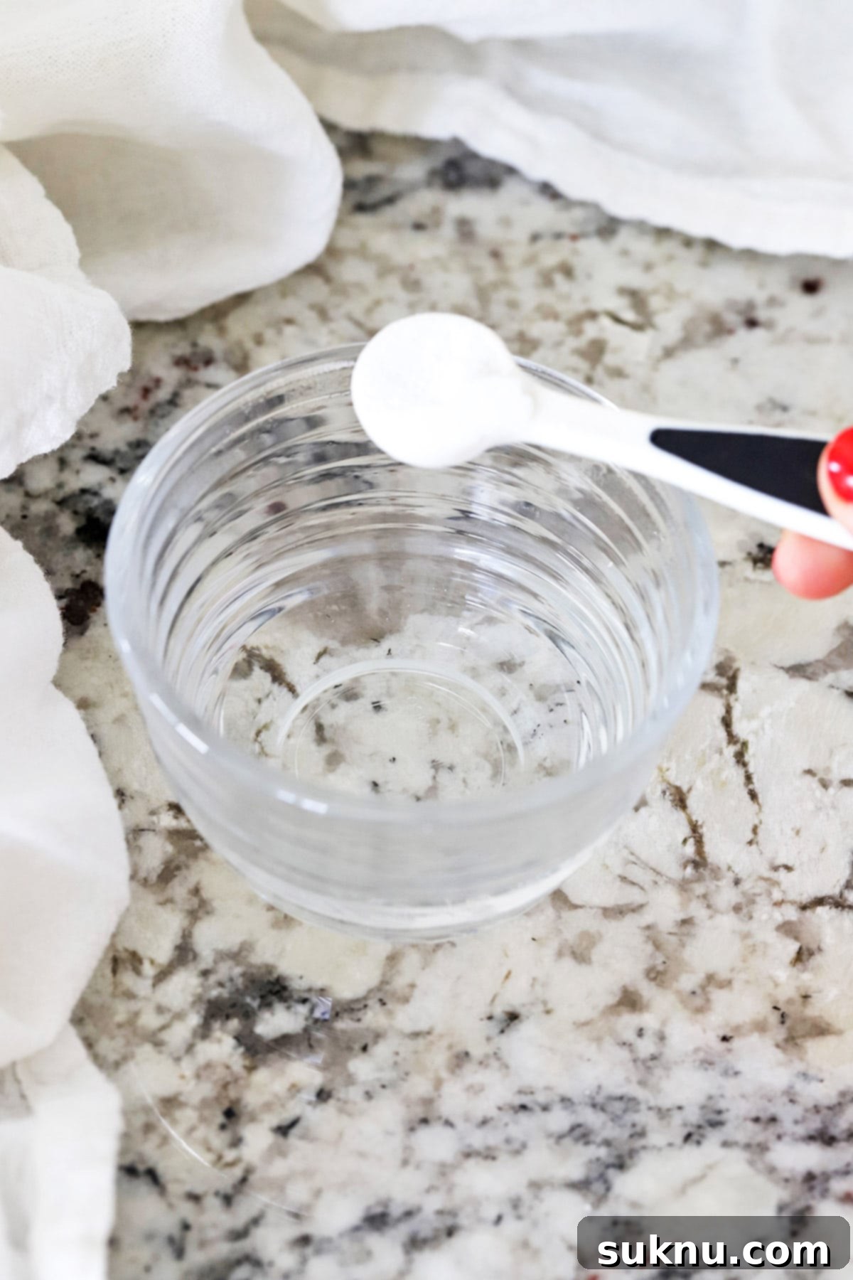 Are Your Baking Powder and Soda Still Potent 7 Adding baking powder to a bowl of warm water to test its freshness, a simple kitchen experiment.