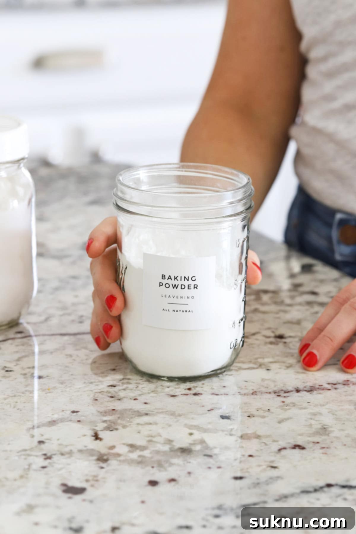 Are Your Baking Powder and Soda Still Potent 9 A jar of fresh baking powder, ready to be used in baking for perfect rise and texture.