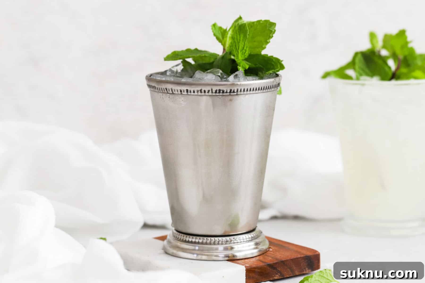 Strawberry Basil Bliss Lemonade 10 Two non-alcoholic mint juleps in traditional metal julep cups, garnished with fresh mint.