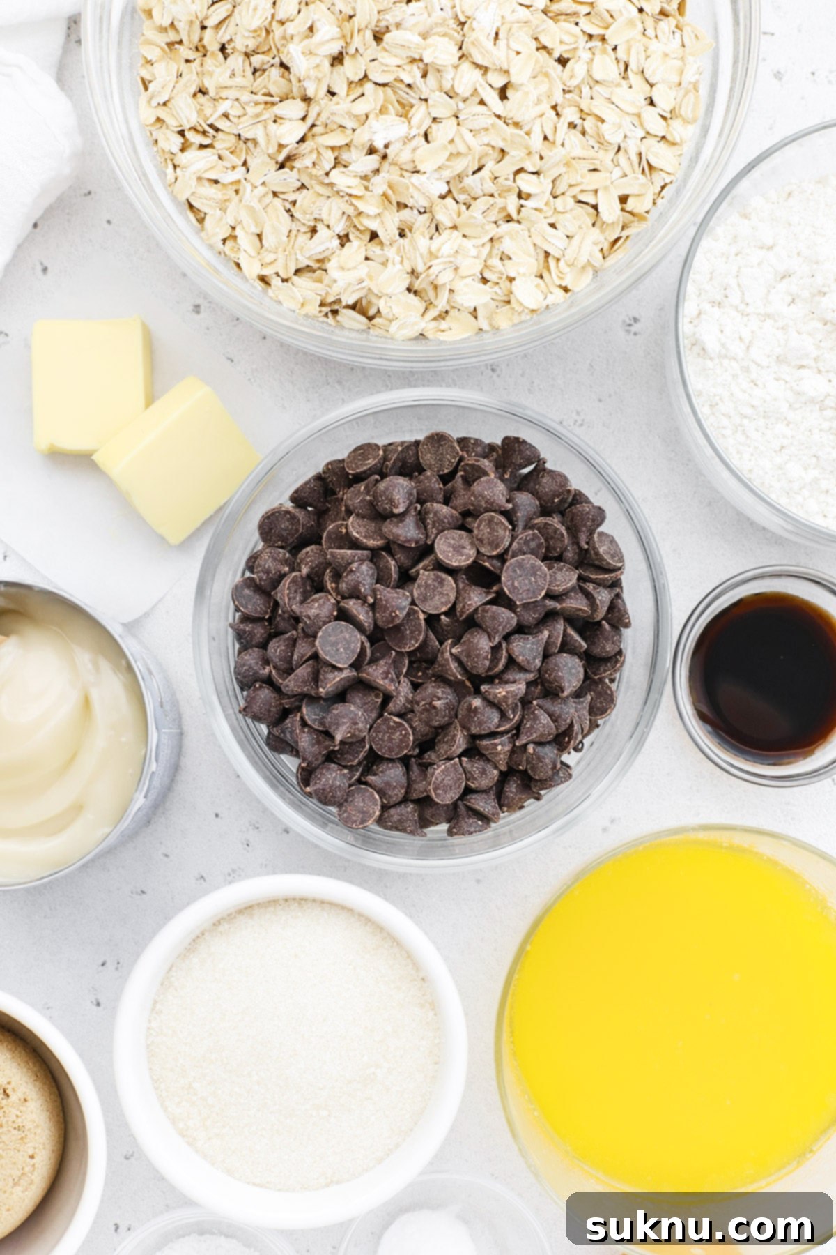 Decadent Gluten-Free Oatmeal Fudge Bars 3 Ingredients for gluten-free oatmeal fudge bars laid out on a table