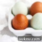 Unlock Room Temperature Eggs in Minutes 12 Front view of multicolor farm eggs in a white egg carton, illustrating the subject of the guide.