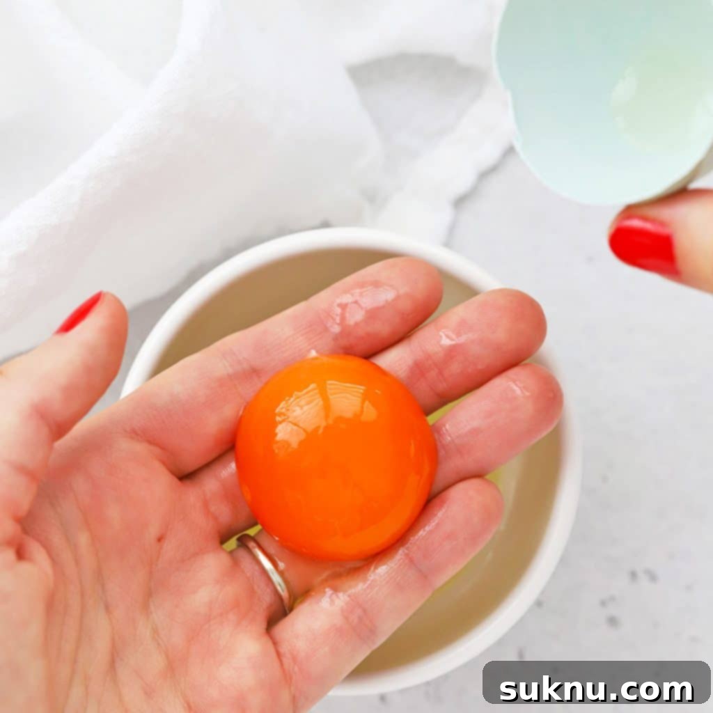 Unlock Room Temperature Eggs in Minutes 7 Graphic illustrating how to separate eggs, an important baking technique.