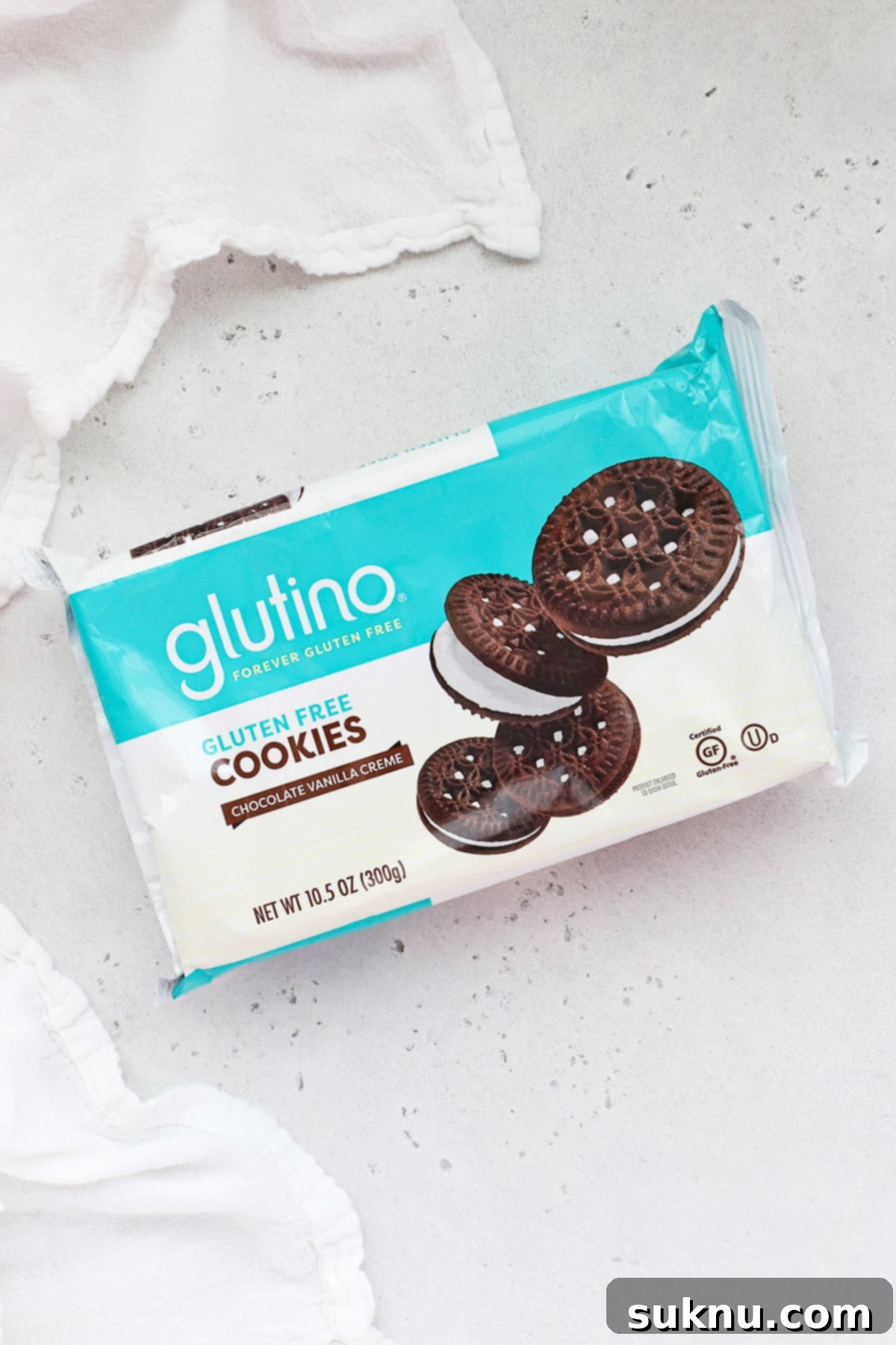 Glutino chocolate creme gluten-free chocolate sandwich cookies arranged on a plate.