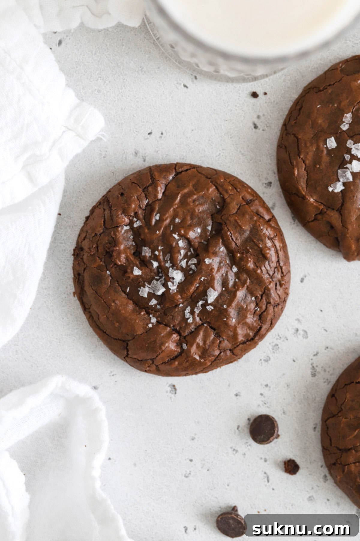 Gluten-free brownie cookies on a pristine white backdrop, showcasing their rich color and texture.