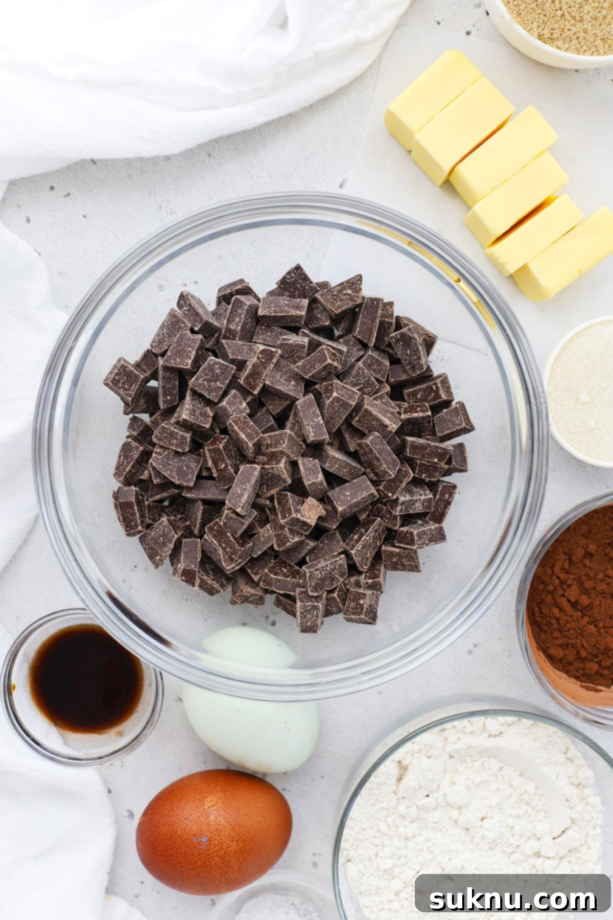 Ingredients for gluten-free brownie cookies laid out on a surface.