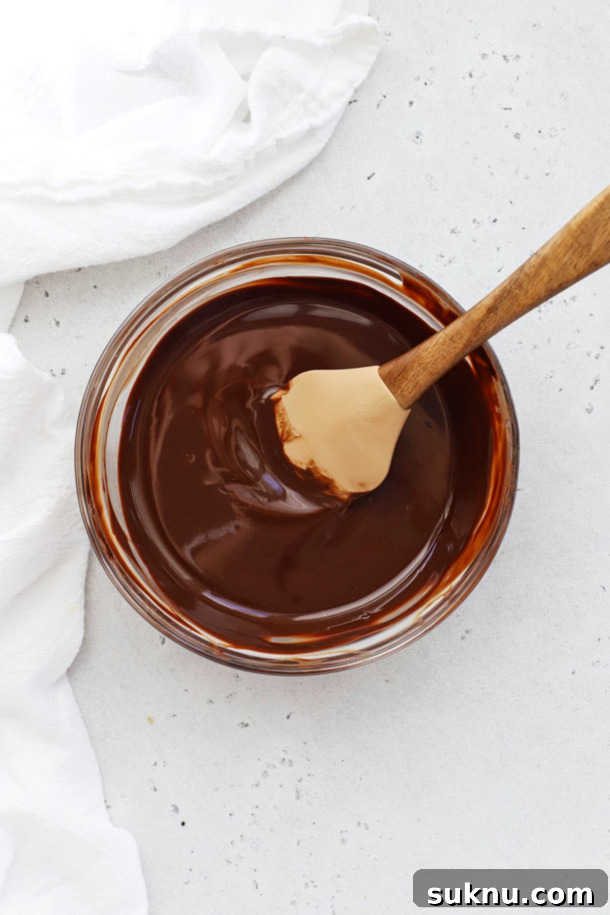 Smooth, melted chocolate and butter mixture for gluten-free brownie cookies.