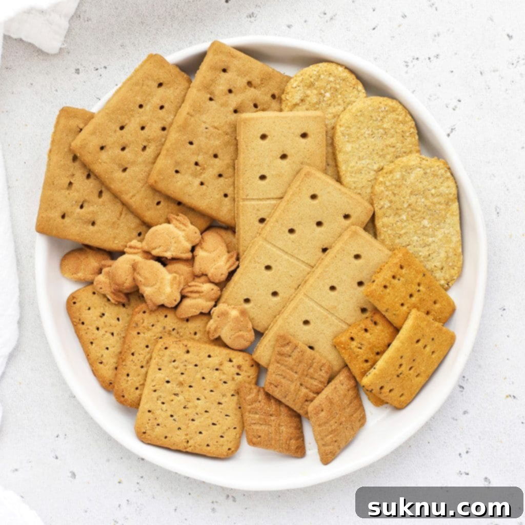 Overhead view of different kinds of gluten-free graham crackers on a white plate