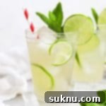 Zesty Mint Lime Mocktail 16 Front view of two glasses of virgin mojito mint limeade