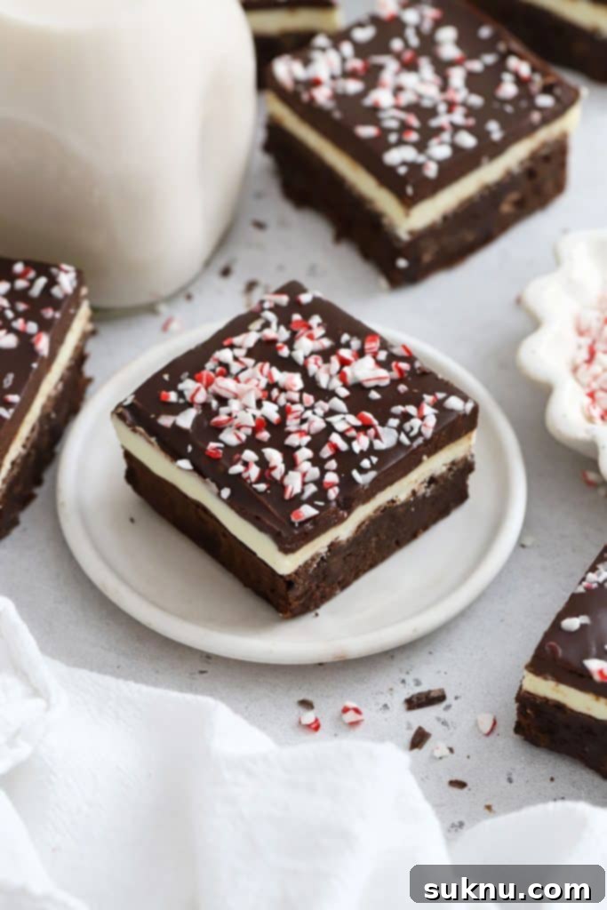 Gluten-free peppermint crunch brownies cut into neat squares, ready for serving.