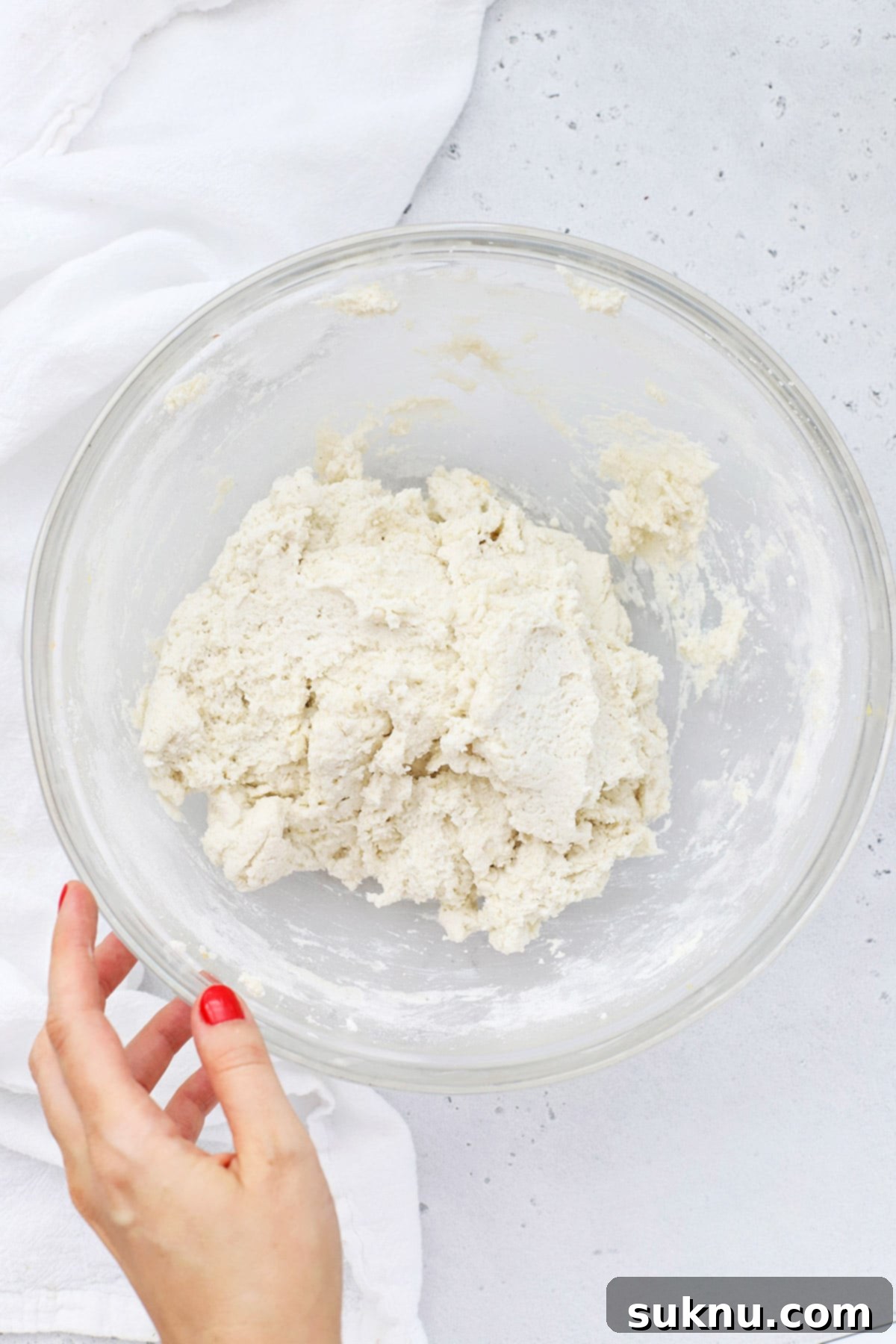 Simple Delicious Gluten-Free Peach Cobbler 7 An overhead view of the freshly mixed, wonderfully fluffy gluten-free biscuit topping dough, perfectly textured and prepared for scooping.