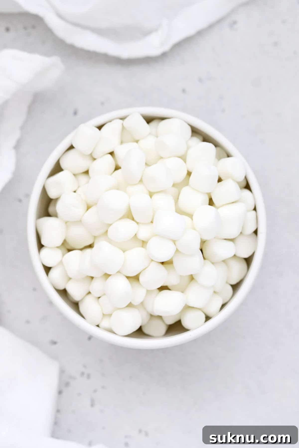 Overhead view of a bowl of mini marshmallows