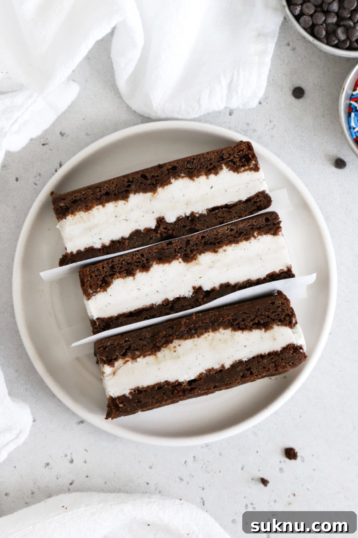 Overhead view of three gluten free ice cream sandwiches on a plate