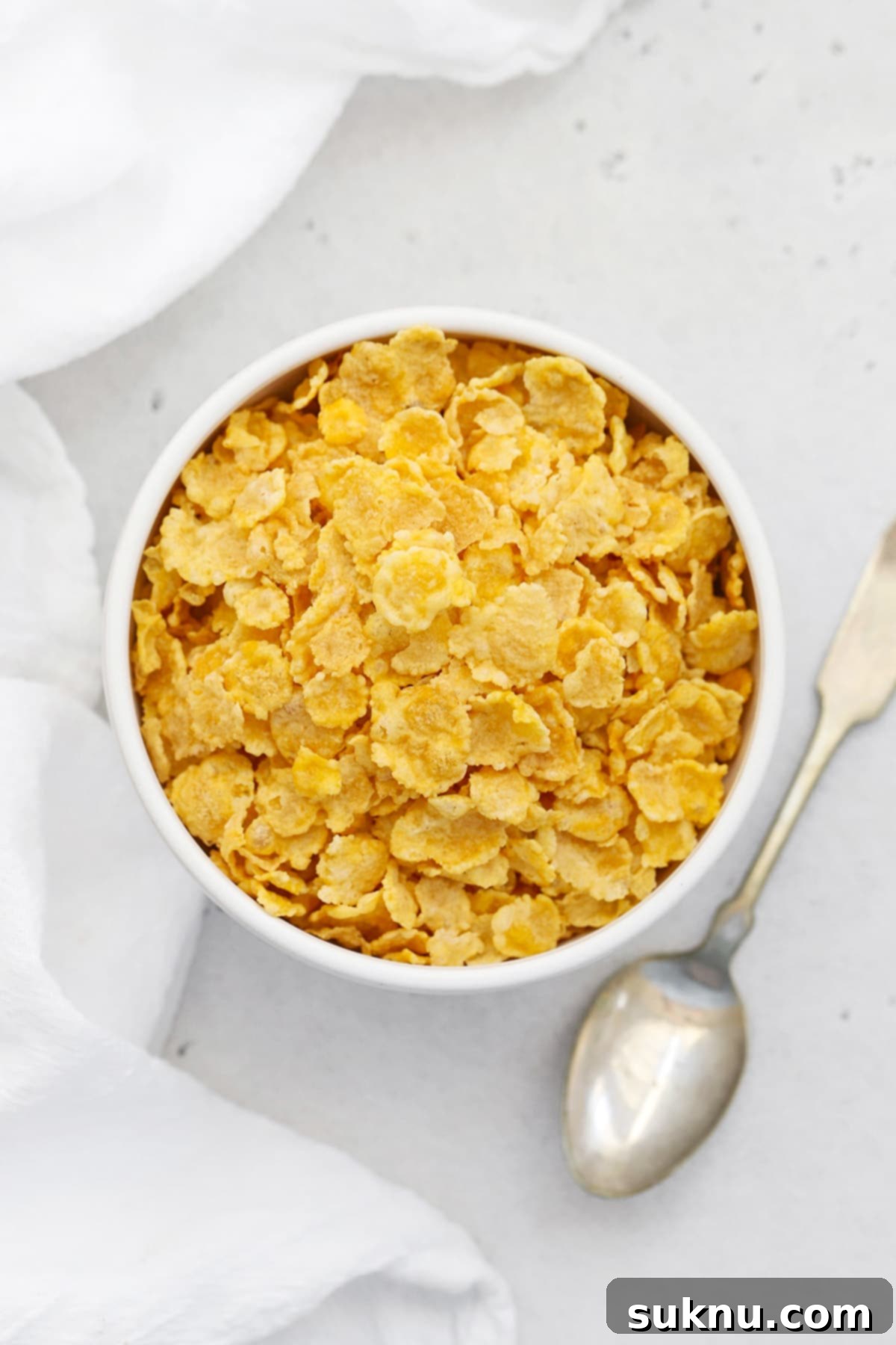 A crisp bowl of gluten-free corn flakes, ready for breakfast
