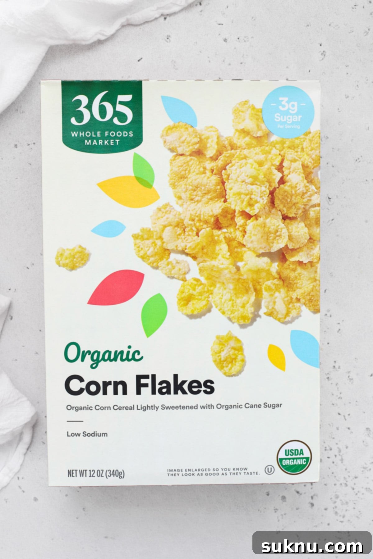 A box of Whole Foods 365 Organic Corn Flakes, showcasing its minimalist packaging and organic claims