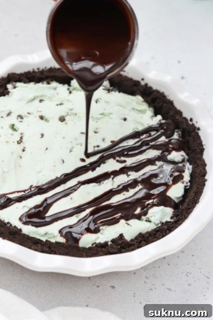 Drizzling chocolate sauce on gluten-free grasshopper pie