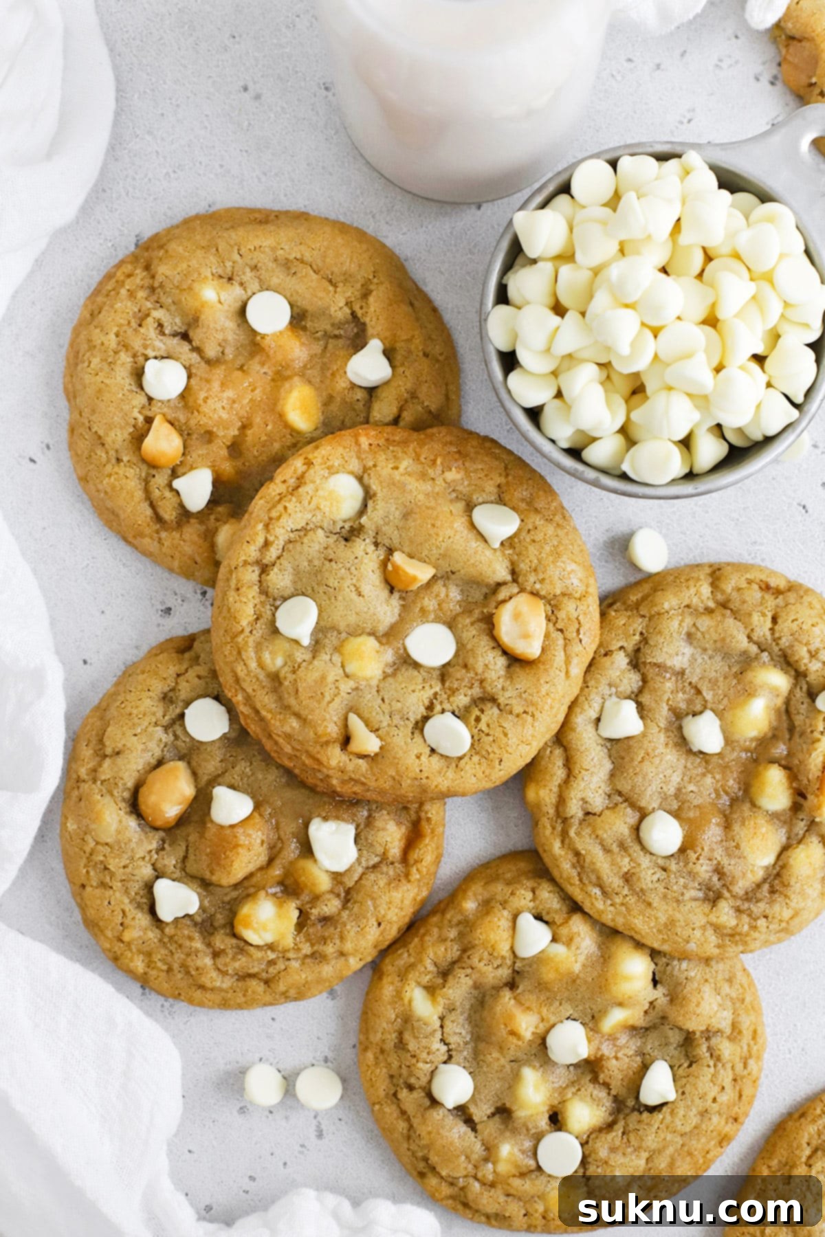 Overhead view of gluten-free white chocolate macadamia cookies stacked