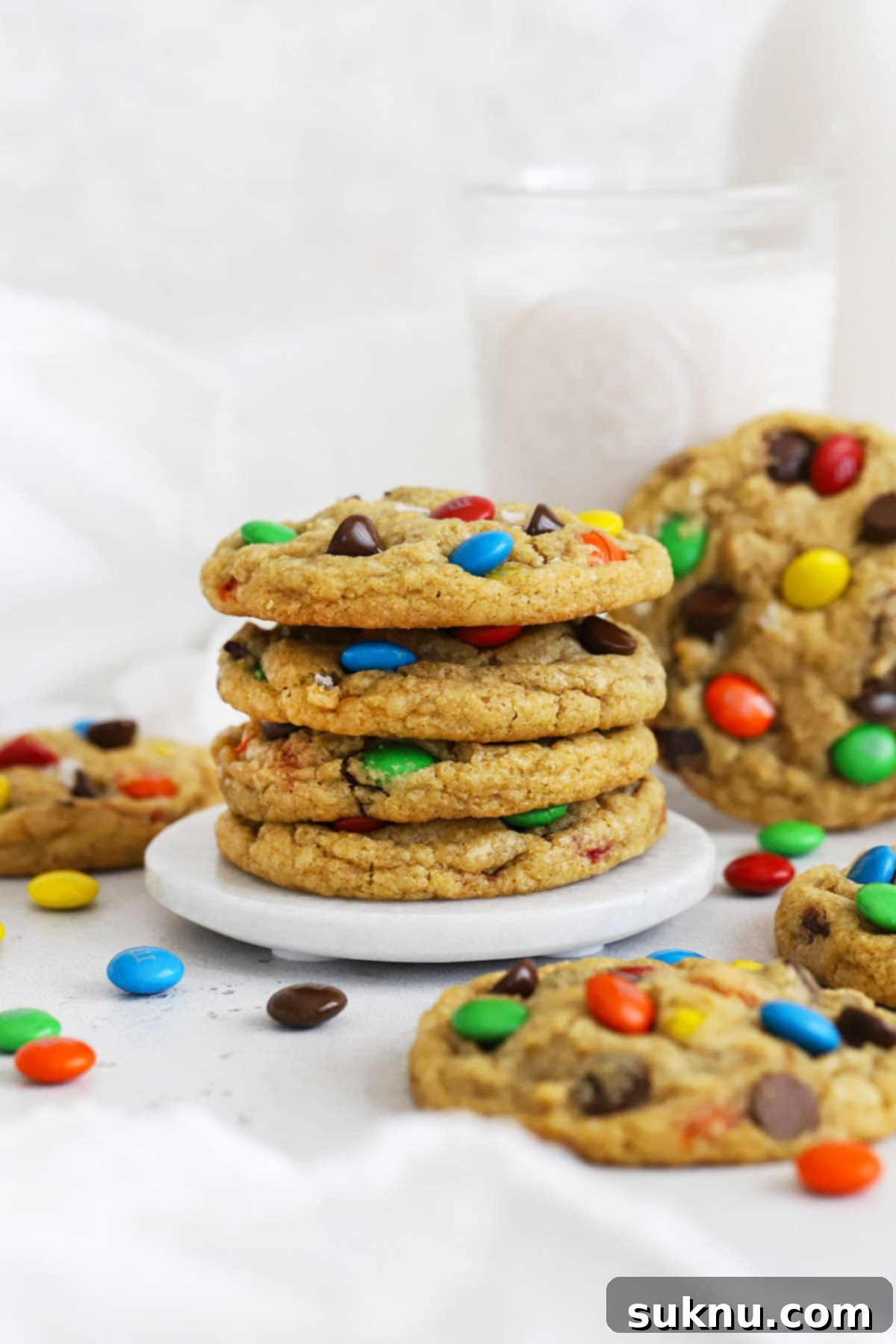 Soft & Chewy Gluten-Free M&M Cookies 6 Front view of gluten-free M&M cookies perfectly stacked, highlighting their soft texture and vibrant colors