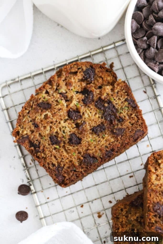 Multiple slices of soft gluten-free chocolate chip zucchini bread arranged appealingly.