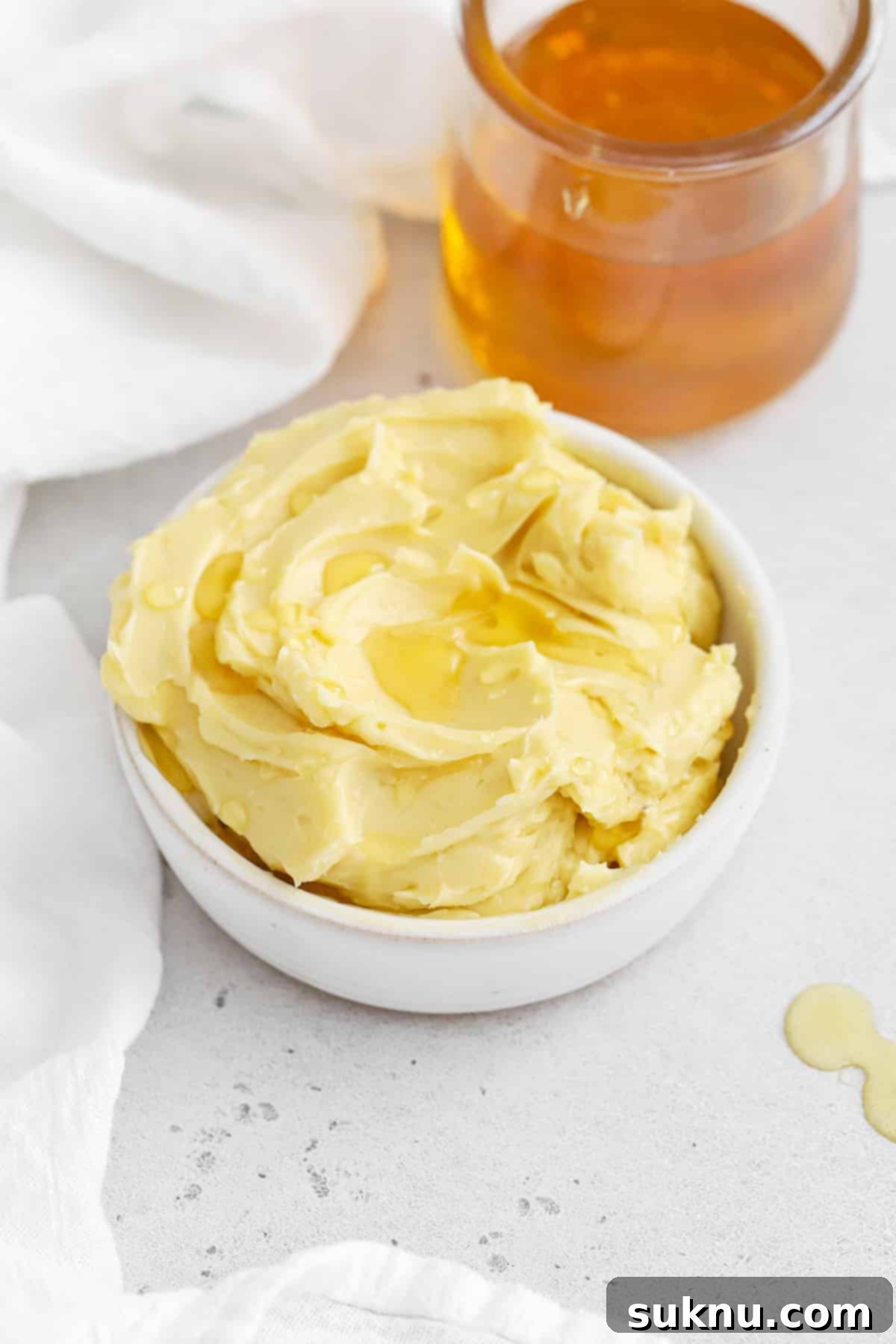Fluffy Honey Butter Made in Minutes 11 Front view of whipped honey butter drizzled with honey, highlighting its smooth texture