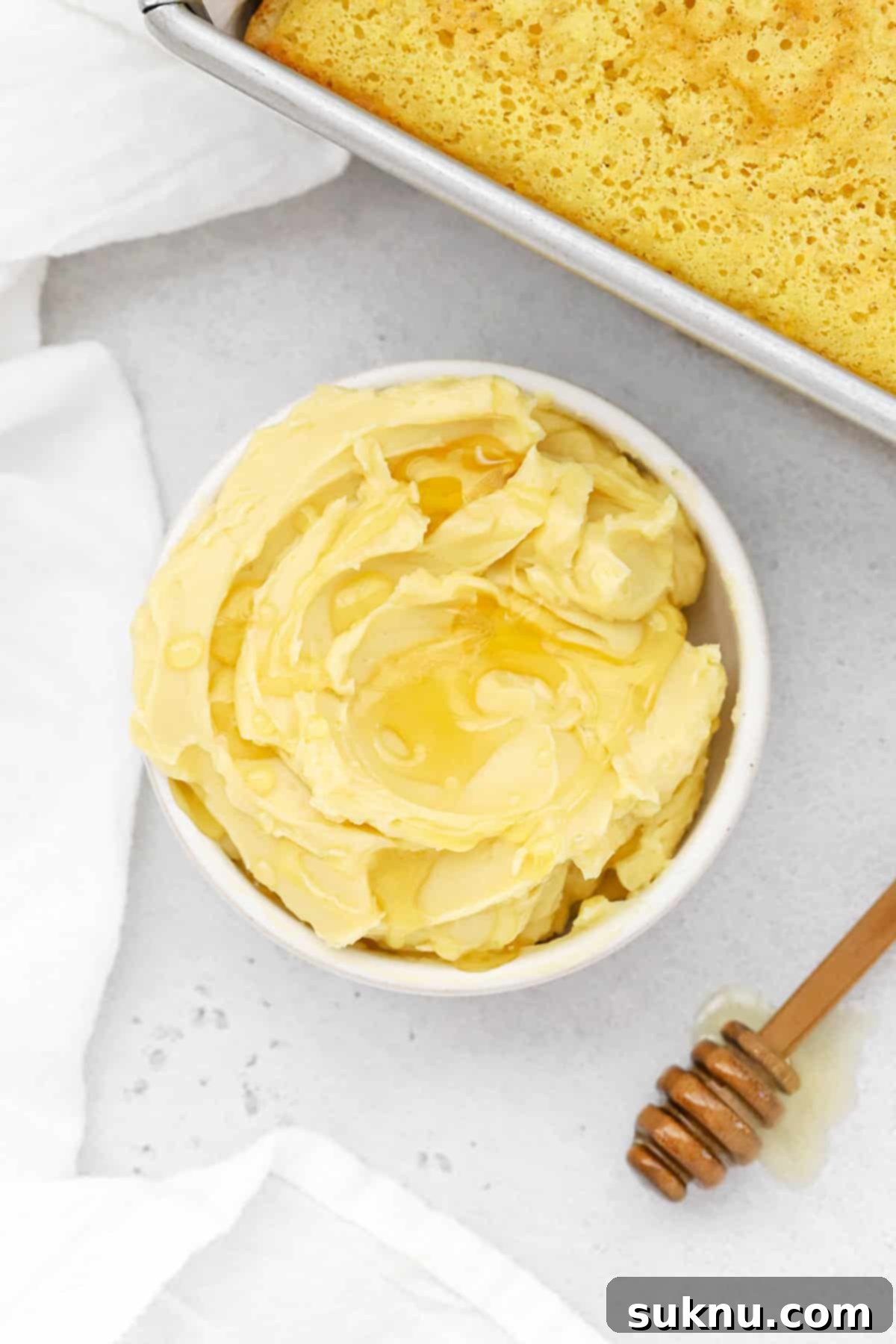 Fluffy Honey Butter Made in Minutes 16 Overhead view of whipped honey butter in a white bowl