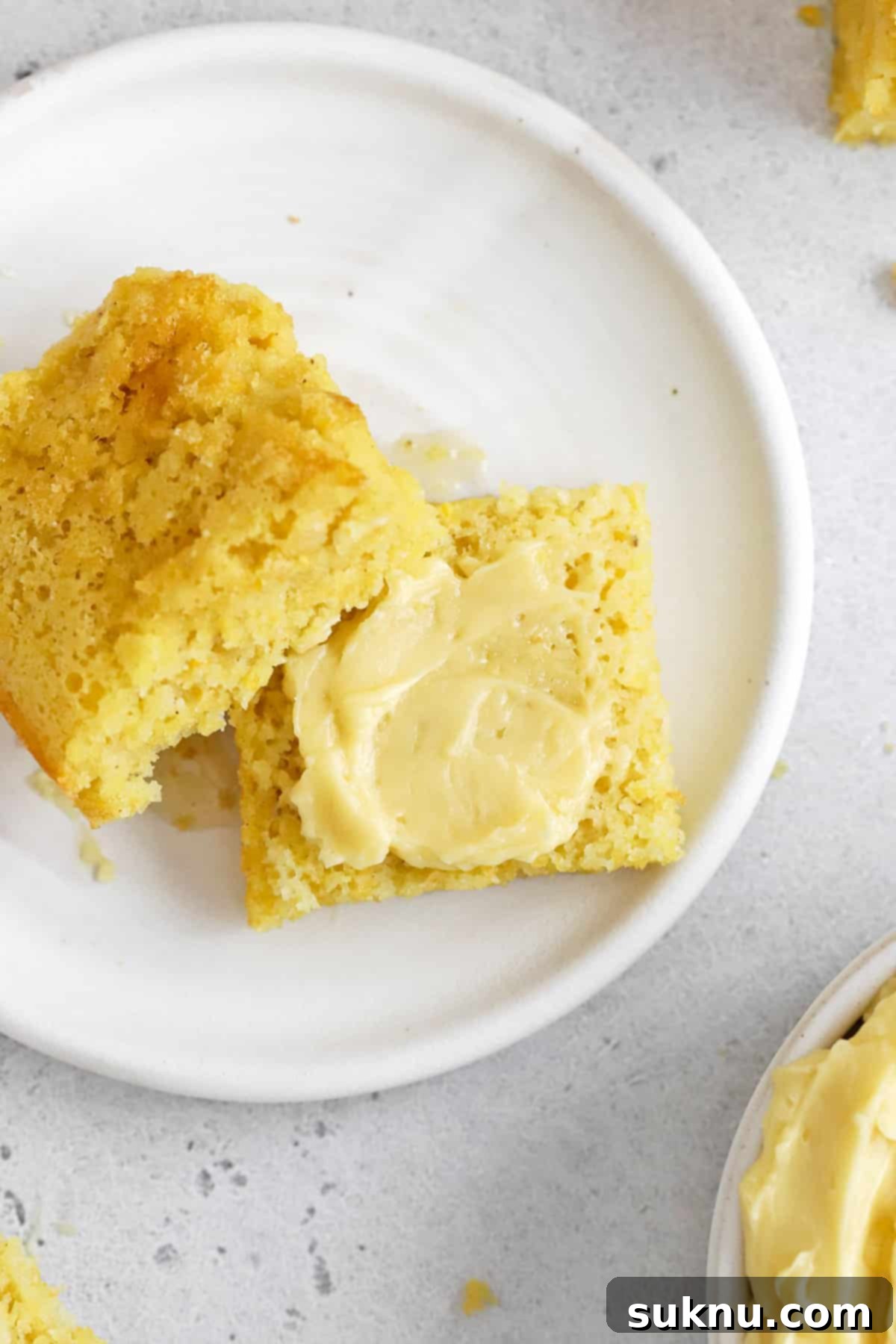 Fluffy Honey Butter Made in Minutes 10 Front view of gluten-free cornbread spread with whipped honey butter, showcasing its fluffy texture