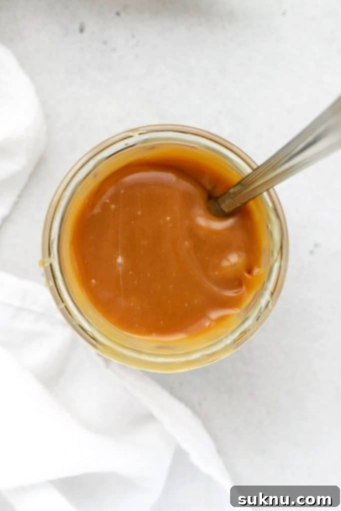 overhead view of a jar of homemade caramel sauce