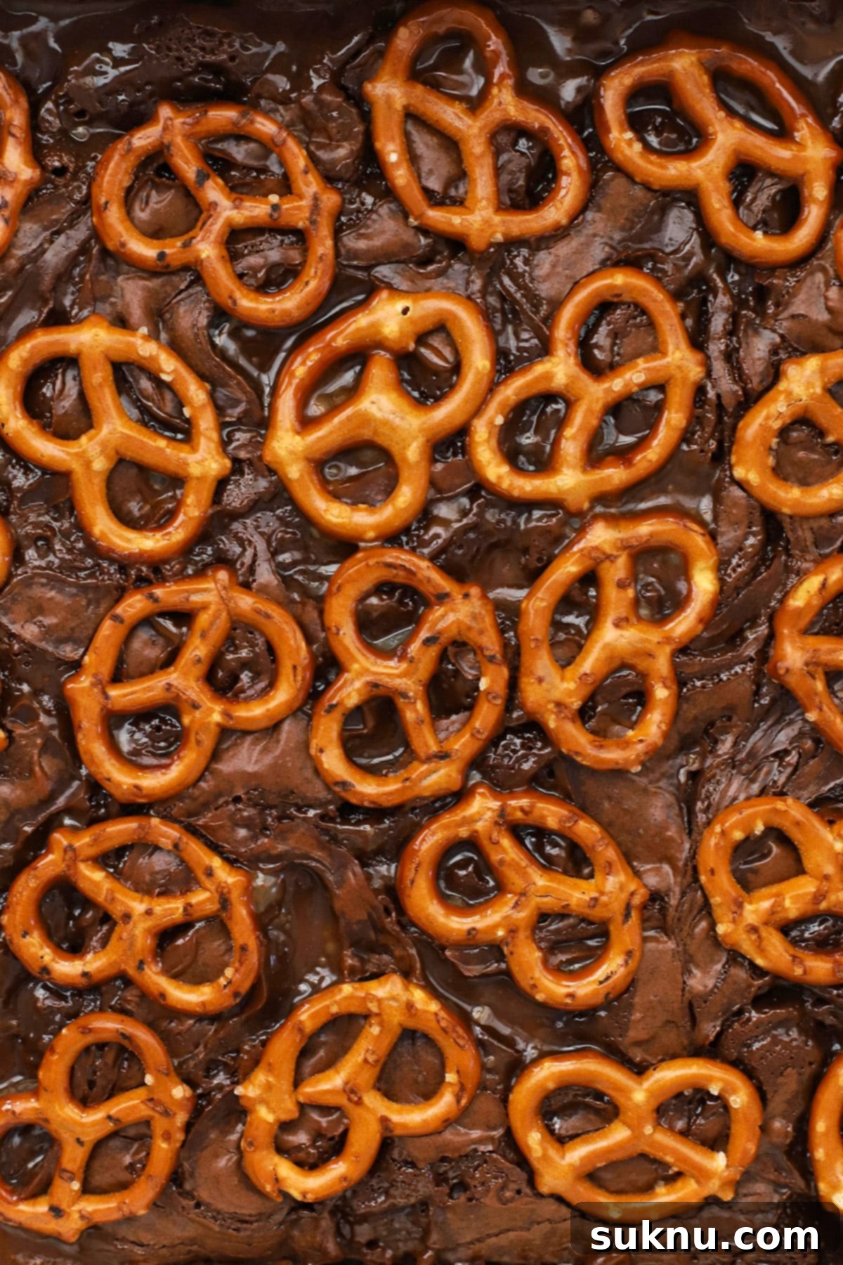 Freshly baked gluten-free caramel pretzel brownies, golden and delicious, just removed from the oven.