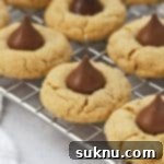 Gluten-free peanut butter blossoms cooling on a wire rack