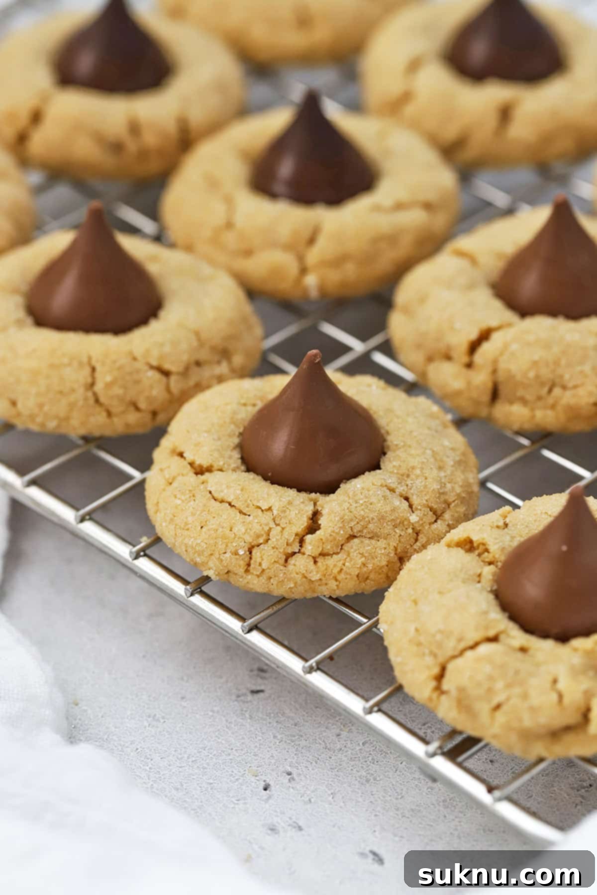 Gluten-free peanut butter blossoms cooling on a wire rack